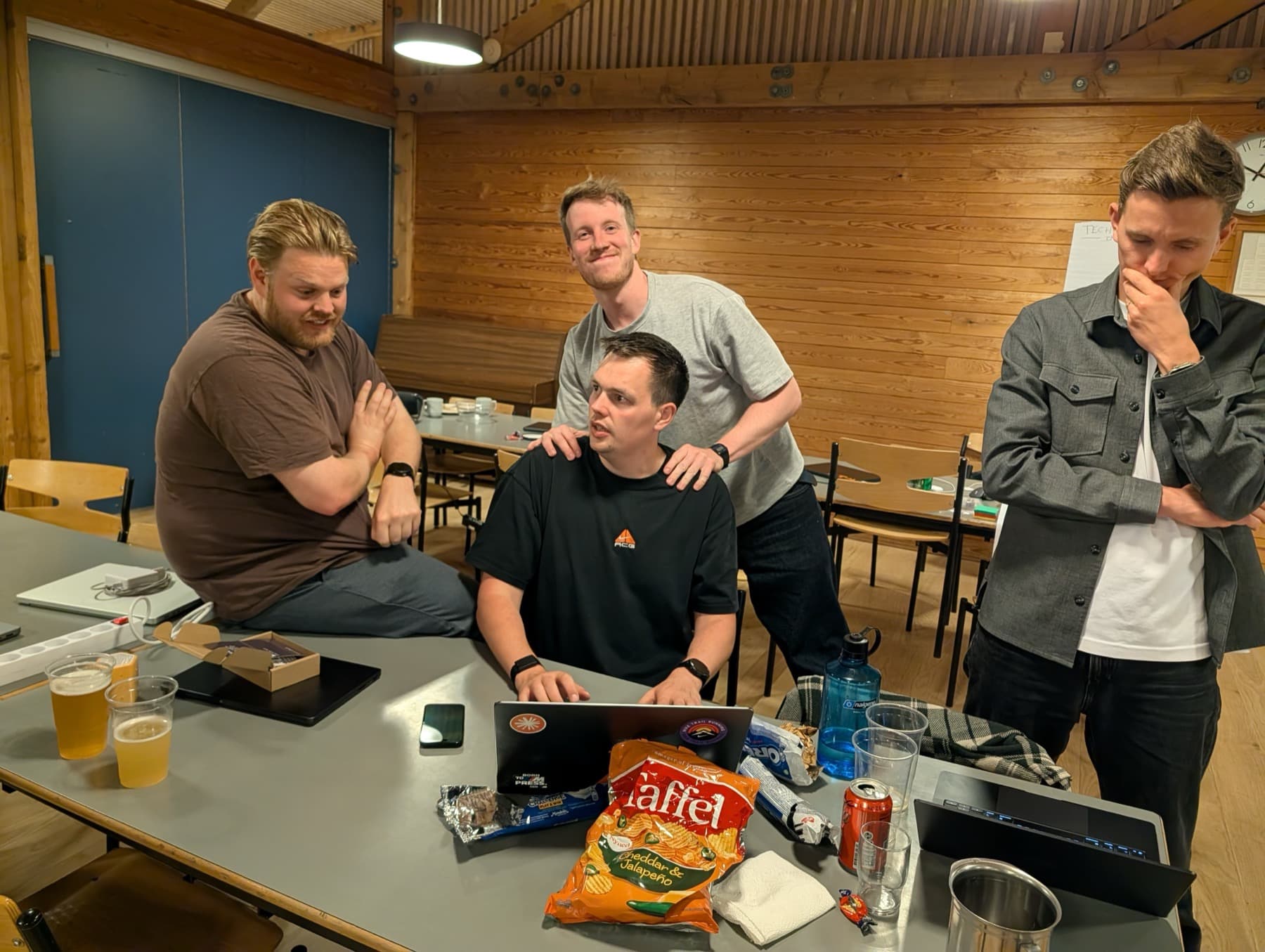 A late-night build session with snacks, laptops, and opinions